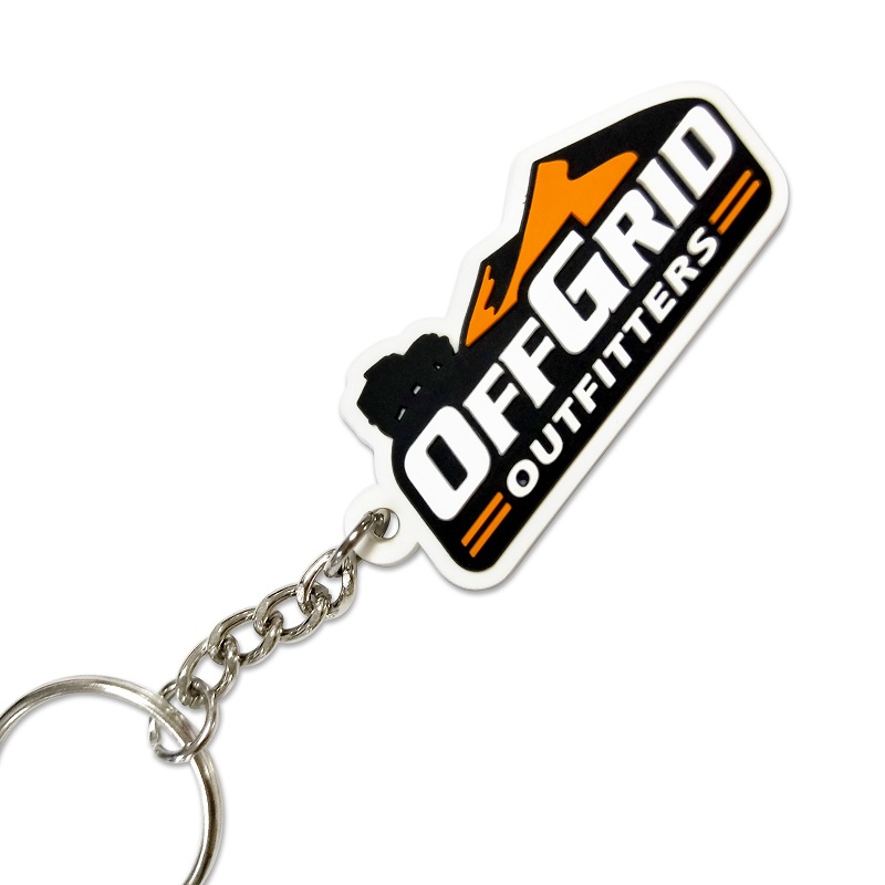Custom rubber keyrings for a camper trailer company with a 2D logo in 2 colours on the front.
