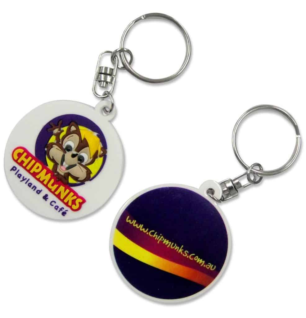 A circular custom rubber keychain for a children's indoor play centre, with a detailed, eight-colour 2D logo.