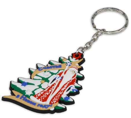 Rubber key ring in shape of a Christmas tree with Santa Clause on thre front.