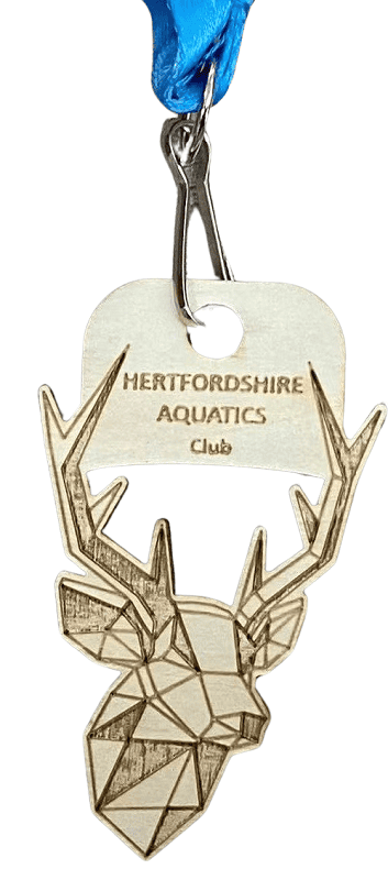 Cut to shape custom wood medal with an engraved logo for an Aquatics Club