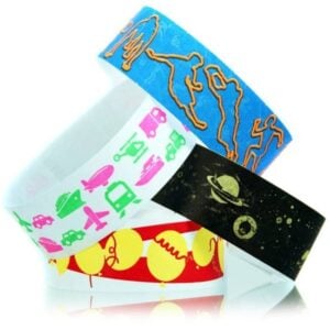 Variety of colourful themed Tyvek wristbands for events in, Australia, including crime scene, transportation, balloons, and space designs. Request a quote for custom printed disposable wristbands from QW Direct.