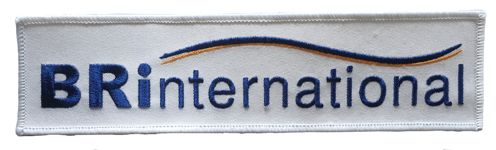 Rectangular embroidered patch with white backing and company logo in navy blue stitched writing.