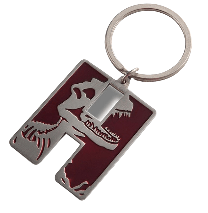 Custom metal keyring cut in letter H shape and engravd on the front to form a dinosaur head.