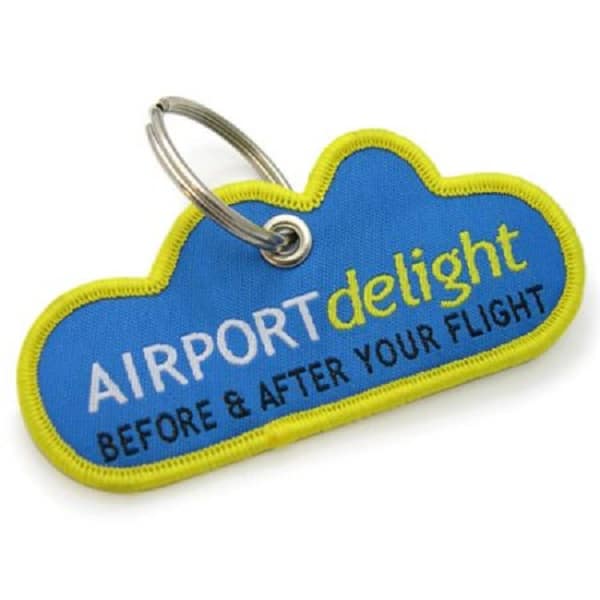 Airport flight embroidered keyring with 2 colour logo and cut to special shape.