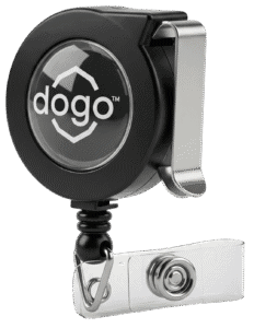 A professional studio photograph of a black retractable badge reel, showing the clear domed logo area and the secure belt clip on the back.