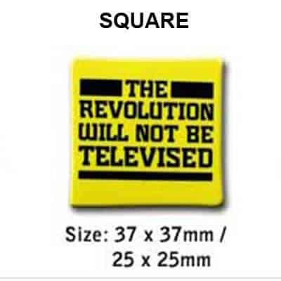 Example of a square shaped button badge with black text printed onto a yellow background. These square button badges ares available in either 37x37mm or 25 x 25mm.