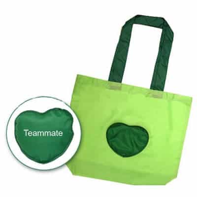 Green coloured personalised folding shopping bag in 210T Polyester material. It has a 1 colour logo printed and folding slide fastener.