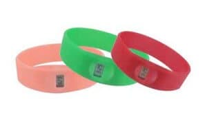 Personalised Silicone Wristband with digital clock. Examples pictured are pink, green and red bands.
