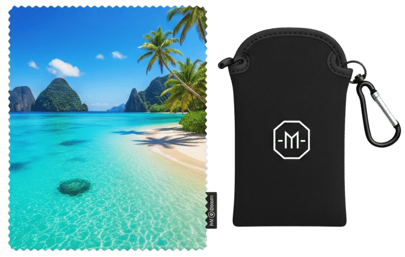A flat-lay of a custom printed microfibre cloth with a tropical beach scene, shown next to its branded black pouch.
