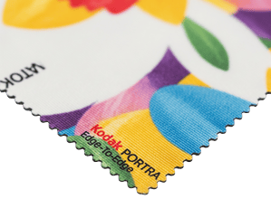 A close-up macro shot of a smooth, silk like microfibre cloth, highlighting the material and the quality of the edge to edge printing