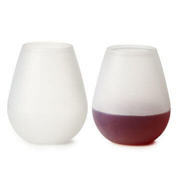 Two silicone drinking glasses which can be branded with your own logo. One pictured is empty and the other has a wine filled within one third of the cup.