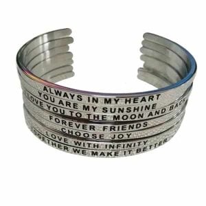 A custom stainless steel bracelet with a black laser engraved logo on the front plate.