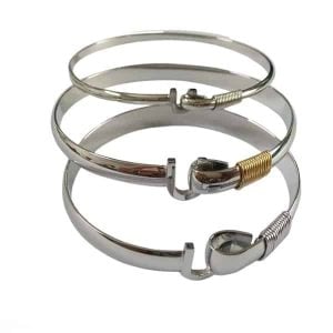 A custom metal bracelet designed as a unique, modern jewellery piece with a polished finish.