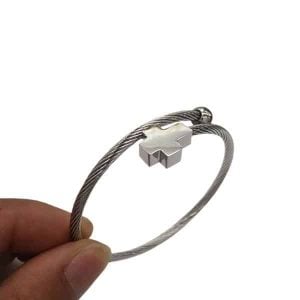 A custom stainless steel bracelet designed in the form of a thick, cable wire band.