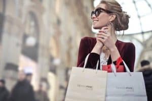 custom_promotional_bags-woman-holding-two-white-and-shoping-bags-compressor1