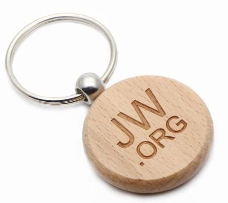 Circular custom wooden keyring with a simple website address engraved into the wood. 