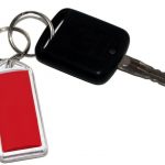 Acrylic keyring with red paper insert.