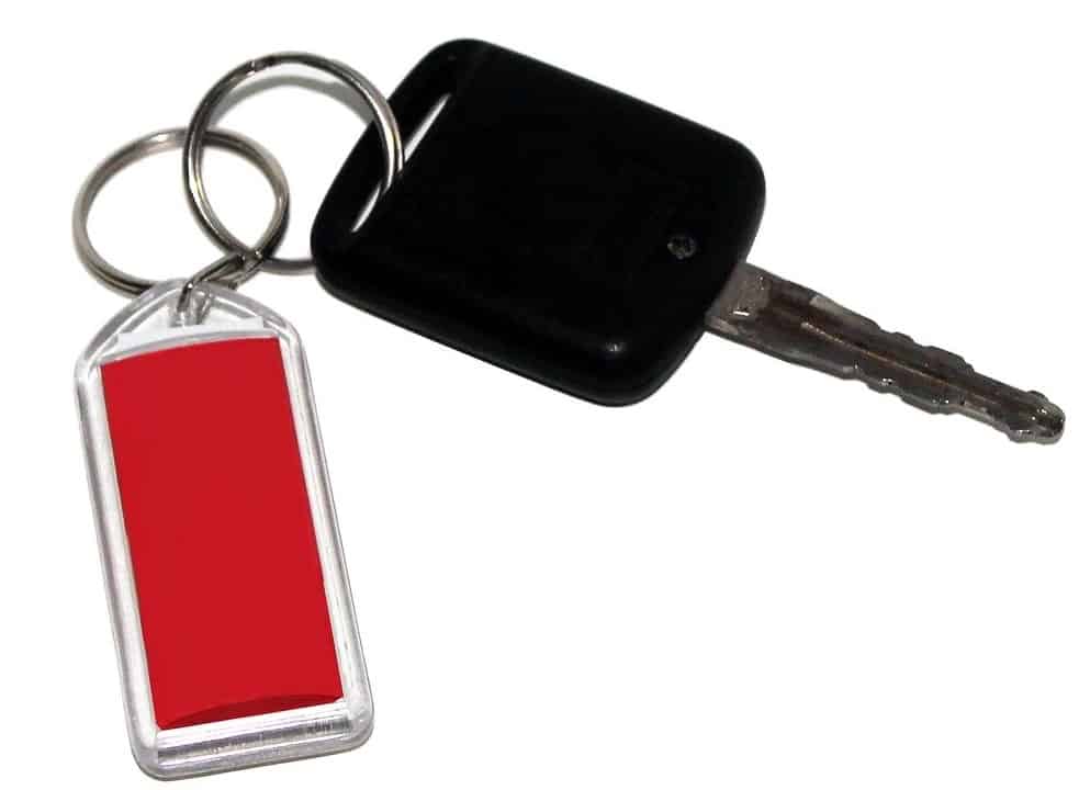 Acrylic keyring with red paper insert.