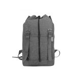 The rear view of a grey casual travel backpack.