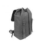 The rear side view of a grey casual travel backpack.