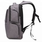 Side view of a grey water resistant college laptop bag.