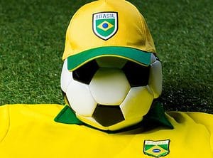 Sports branded wearing promotional products. This features a yellow branded sports cap, and branded sports t shirt.