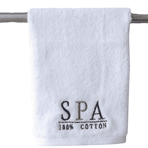 White personalied towel example for a relaxation SPA company. This features an embroidered logo.