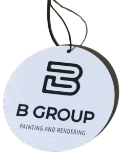 Round white custom air fresheners featuring the black stylized 'B' logo for 'B GROUP PAINTING AND RENDERING'. The company name and services are printed in black beneath the logo.
