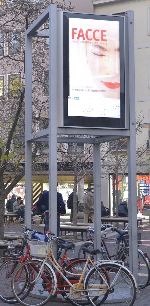 Fashion digital signage screens displayed in a public space.