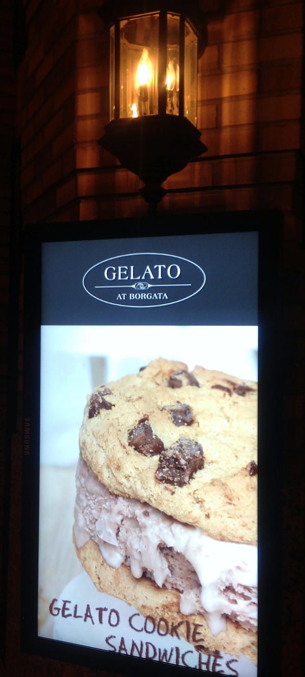 Advertisement for a cookies and cream gelato displayed on a digital signage screen.