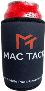 A black neoprene stubby holder with black trim encases a red beverage can with condensation droplets. The holder features a large, stylized orange "M" logo above the white text "MAC TACK" printed on the front. Below the logo, in smaller white text that curves around the bottom edge, are the words "Boots-Saddle Pads-Grooming-". This is a branded can cooler likely used for promotional purposes by the company Mac Tack, which appears to specialize in equestrian products.