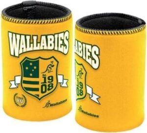 Two yellow neoprene stubby holders with black trim featuring the official logo of the Australian Wallabies rugby union team are shown against a light grey background. The logo includes a shield with the Southern Cross stars, a stylized kangaroo, and the text "Wallabies," "Est. 1908," and "XV FIRST." The word "Wallabies" is also printed in white across the top of one holder and diagonally across the bottom of both. These are can coolers designed to show support for the Australian national rugby team.
