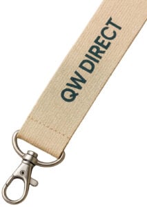 A close-up of a natural-coloured lanyard with the QW Direct logo printed in dark teal, attached to a metal swivel hook.