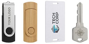 A wholesale collection of various custom USB drives including metal swivel, bamboo, credit card, and key styles, showing the range available for bulk orders.