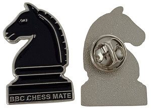 A custom-shaped silver and black enamel badge in the shape of a chess knight, featuring the text "BBC CHESS MATE".